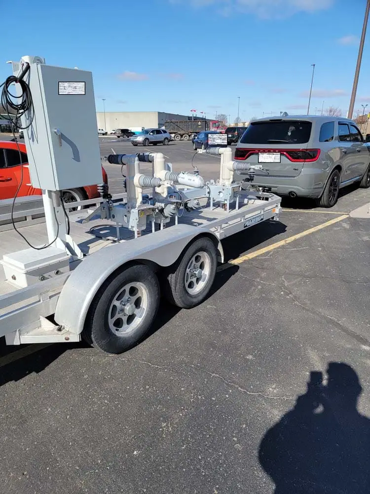 Van with a trailer holding electrical equipment Viper